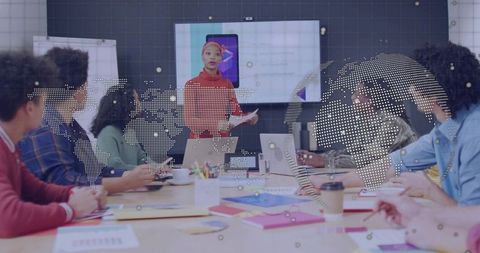 Female Leader Presenting Mobile App Prototype to Team During Boardroom Meeting