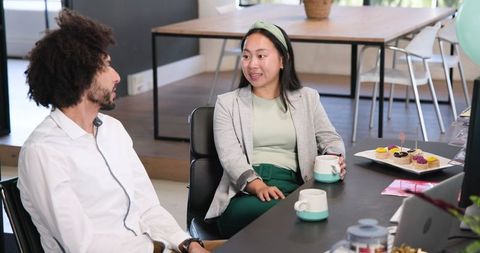 Colleagues Celebrating Office Success with Coffee and Cake