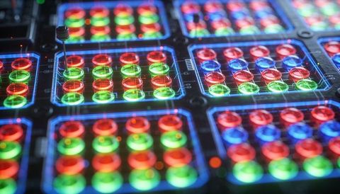 Rgb led panel with vibrant lens domes on glossy pcb, test probe and circuit traces