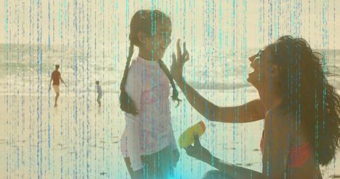 Mother Applying Sunscreen to Daughter on Sunlit Beach with Cyan Glitch Overlay — Family Bonding