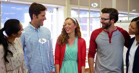 Diverse team networking with social media engagement