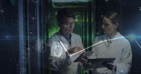 IT Engineers Analyzing Data Tablets in Server Center with Digital Overlay