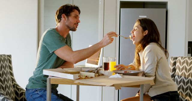 Couple Enjoying Takeout Pizza During Relaxed Evening at Home - Download Free Stock Images Pikwizard.com
