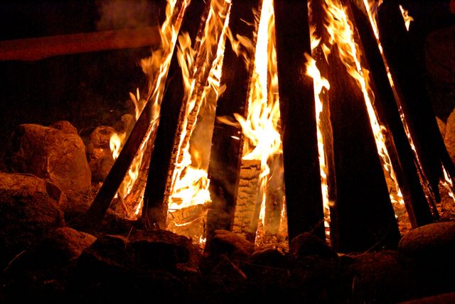 Large Campfire Burning Among Rocks in the Dark - Download Free Stock Photos Pikwizard.com