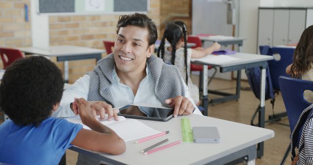 Male Teacher Helping Students in Classroom Setting - Download Free Stock Images Pikwizard.com