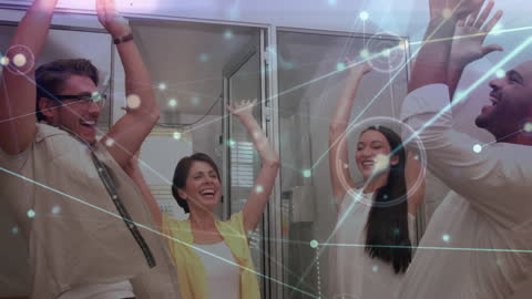 Dynamic Business Team Celebrating Success with Digital Overlay