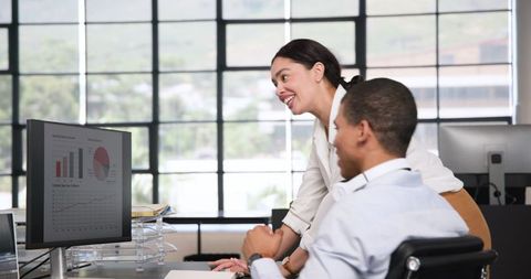 Colleagues Celebrating Success with High Five in Modern Office