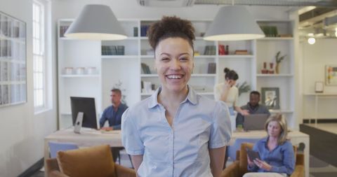 Happy Businesswoman Smiling in Modern Workplace