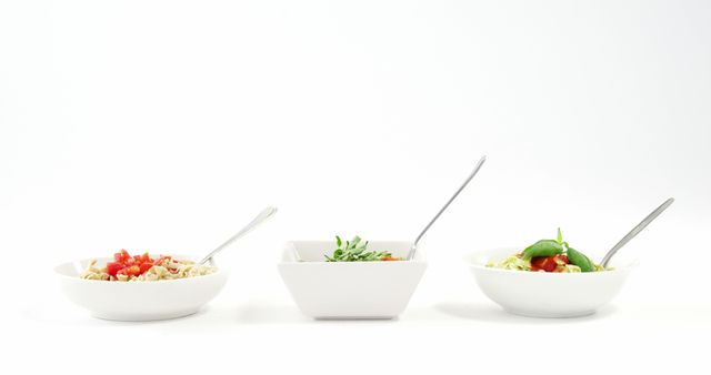 Assorted Fresh Salads in White Bowls with Spoons on White Background - Download Free Stock Images Pikwizard.com