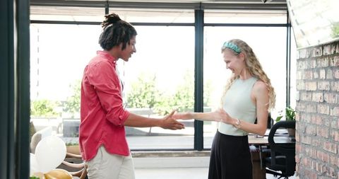 Diverse colleagues celebrating office ribbon cutting ceremony