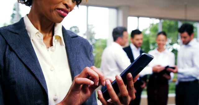 Businesswoman Using Mobile Phone at Work - Download Free Stock Images Pikwizard.com