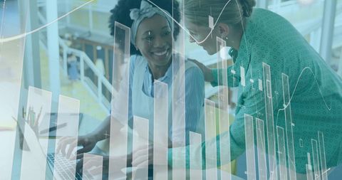 Collaborative teamwork in modern business environment with financial graphs