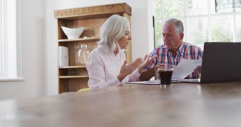 Elderly Couple Managing Finances at Home