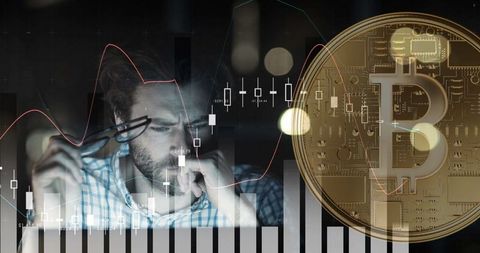 Focused man analyzing cryptocurrency market with bitcoin overlay