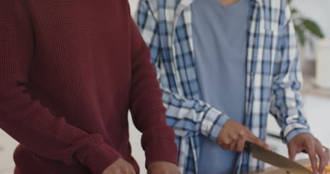 Couple in Casual Attire Chopping Vegetables Together