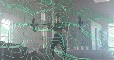 Woman Preparing Workout in Industrial Gym with Teal Motion Lines Overlay