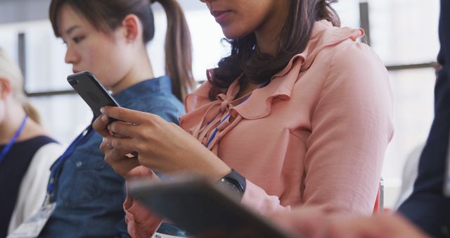 Business Professionals Attending Conference Using Smartphones - Download Free Stock Images Pikwizard.com