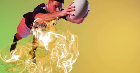 Dynamic Rugby Player Catching Ball with Energetic Light Effects
