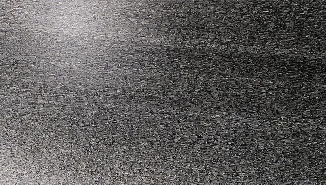 Monochrome static noise texture covering screen fine-grained grayscale digital grain