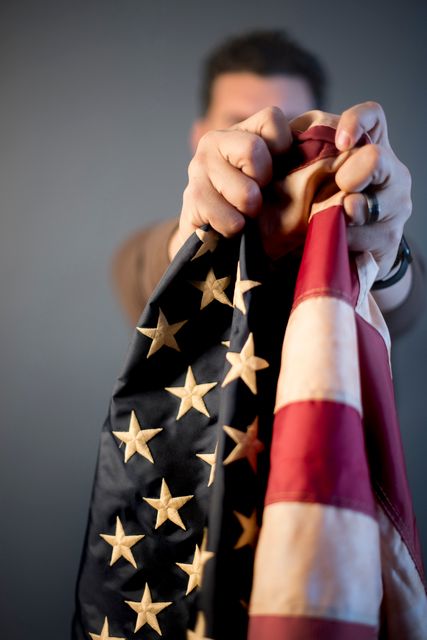 Person Holding Crumpled American Flag - Download Free Stock Photos Pikwizard.com