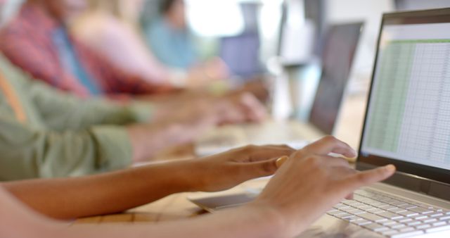 Group of People Working on Laptops with Spreadsheets in Office - Download Free Stock Images Pikwizard.com