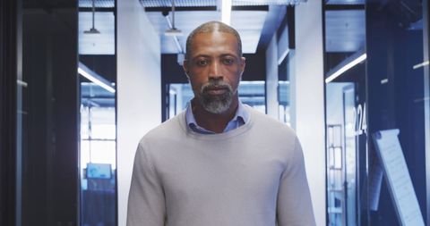 Confident African American Businessman in Modern Office Corridor