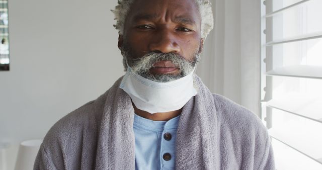 Senior Man in Bathrobe with Face Mask - Download Free Stock Images Pikwizard.com