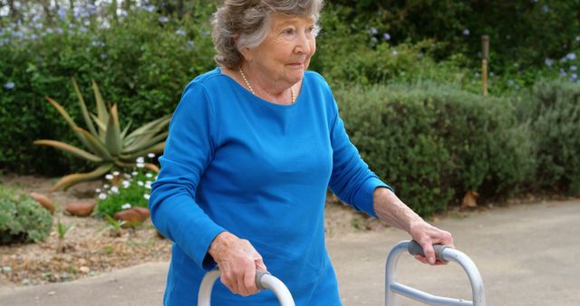 Elderly Woman Using a Walker in Garden - Download Free Stock Images Pikwizard.com