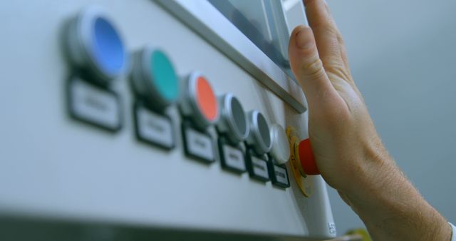 Close-Up of Technician Using Emergency Stop Button on Industrial Control Panel - Download Free Stock Images Pikwizard.com