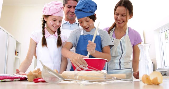 Smiling Family Baking Together in Kitchen - Download Free Stock Images Pikwizard.com