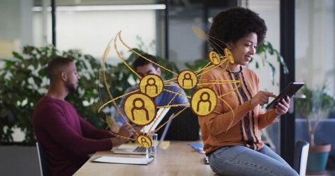 African American Woman Using Tablet in Modern Office with Network Graphics