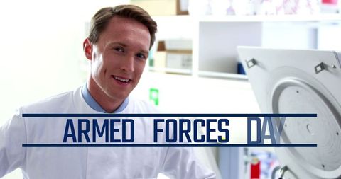 Caucasian male doctor celebrating armed forces day with a smile