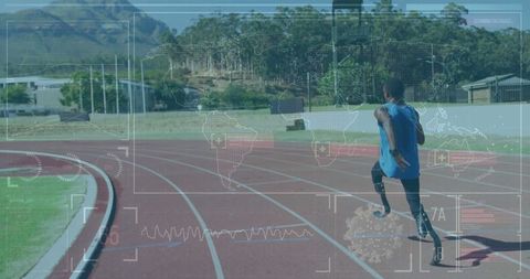 Teen Athlete with Prosthetic Blades Sprinting on Track