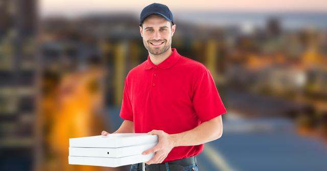 Delivery man holding pizza boxes - Download Free Stock Photos Pikwizard.com