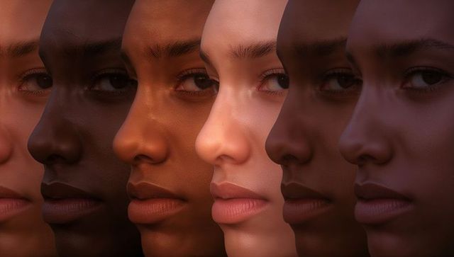 Diverse female faces creating seamless skin tone gradient in dramatic studio lighting