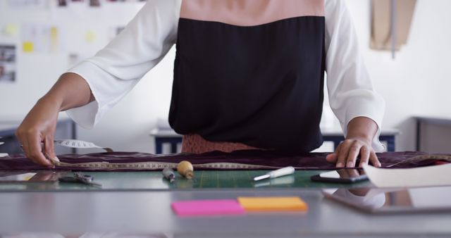 Female Fashion Designer Measuring Fabric in Sewing Studio - Download Free Stock Images Pikwizard.com