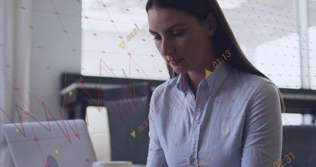 Woman Analyzing Financial Data on Laptop in Modern Office - Download Free Stock Images Pikwizard.com