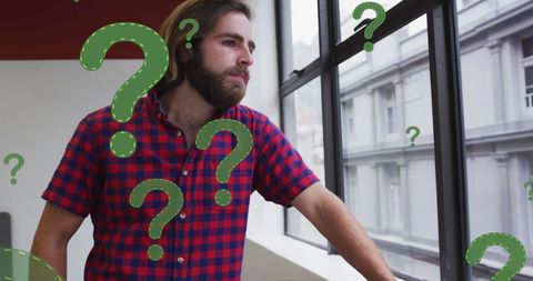 thoughtful businessman contemplates with question marks - Download Free Stock Images Pikwizard.com