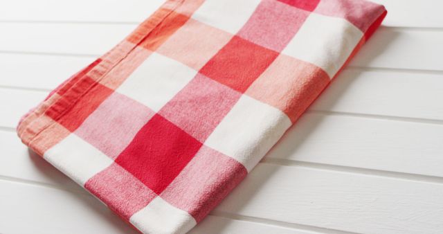 Close up of folded red and white checkered blanket on white background with copy space - Download Free Stock Photos Pikwizard.com