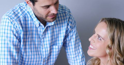 Happy Couple Smiling in Cozy Home Setting