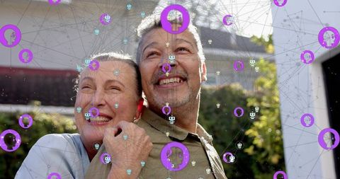 Mature couple enjoying backyard sunlight with digital network overlay and avatar icons