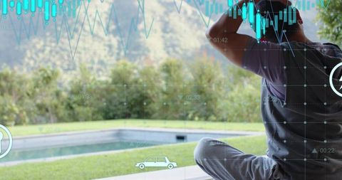 Man sitting by pool wearing backpack and viewing mountain landscape with hud overlay