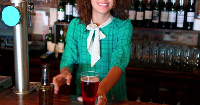 Smiling Bartender Serving Beer at Bar Counter - Download Free Stock Images Pikwizard.com