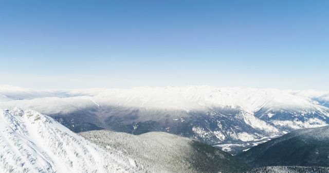 A breathtaking snowy mountain landscape under a clear blue sky - Download Free Stock Photos Pikwizard.com