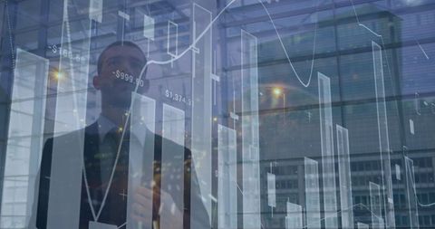 Businessman analyzing financial data in futuristic workplace