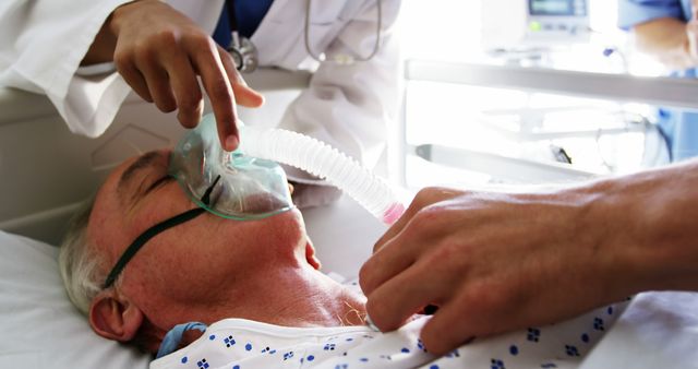 Elderly Patient Receiving Oxygen Support From Medical Professionals in Hospital - Download Free Stock Images Pikwizard.com