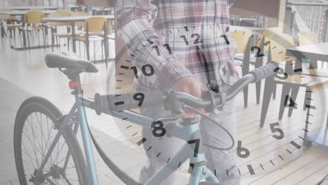Person Holding Bicycle in Modern Workspace with Overlaying Clock