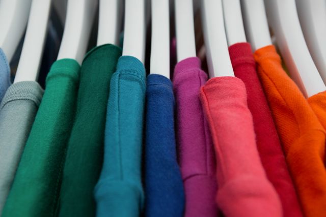 Close-up of various t-shirts hanging on cloth hanger