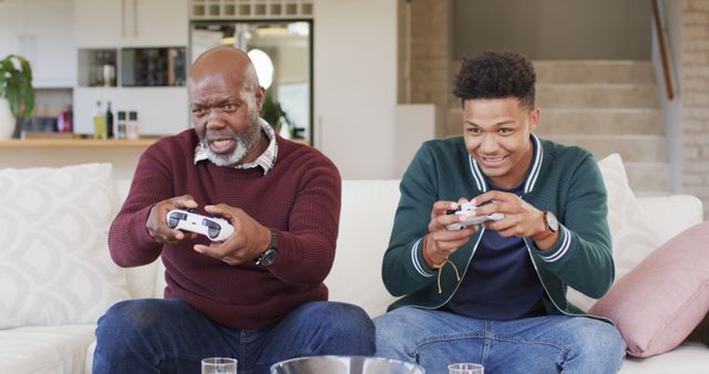 Father and Son Enthusiastically Playing Video Games at Home - Download Free Stock Images Pikwizard.com