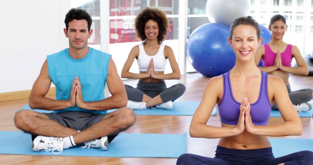 Diverse Group of People Practicing Yoga Together in Gym Studio - Download Free Stock Images Pikwizard.com